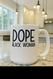 White mug with 'DOPE BLACK WOMAN' text on a kitchen counter