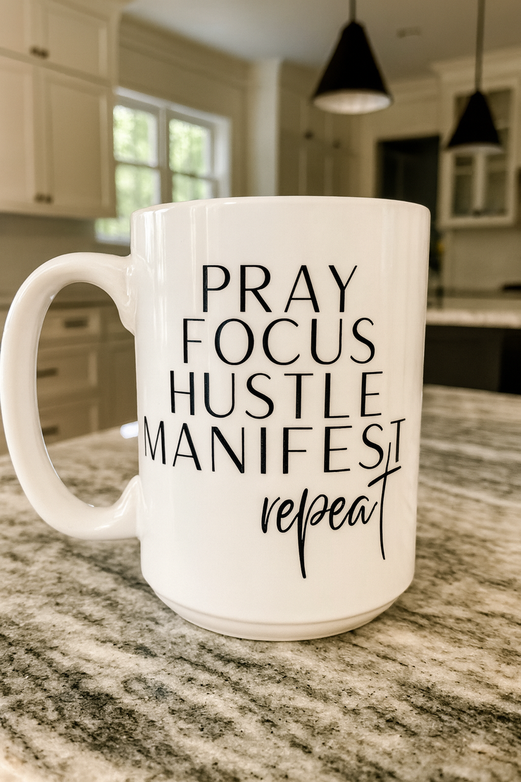 White mug with motivational text on a kitchen counter